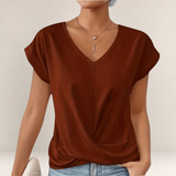 Valvet Oak House rust-colored V-neck t-shirt with short cuffed sleeves and a flattering draped front design.